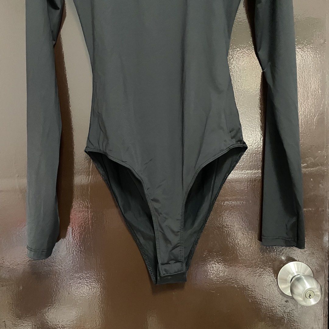 Zara Black Long Sleeve Bodysuit Size M (Category: Longsleeves) located in Pasay City. Submitted by lovedbyzea (Listing ID 1467341006, Image 3). Description: - size M but more on XS - S - Brand: Zara - Style: Long sleeve basic bodysuit with scoop neckline - Size: M (label intact) - Color: Black - Features: Stretch fabric, convenient snap button closure at the bottom - Origin: Made in Bangladesh - Condition: Clean, tags intact, never worn - Great f