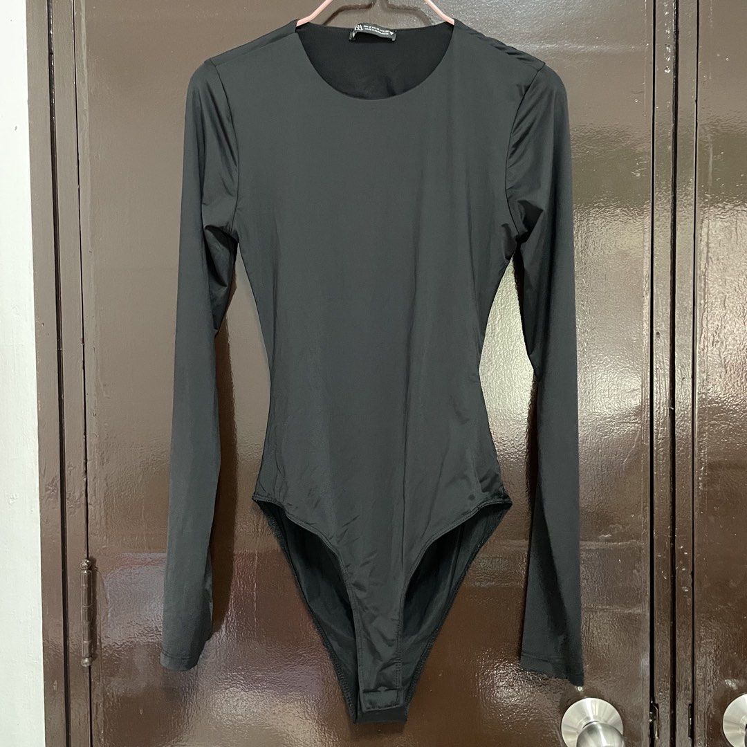 Zara Black Long Sleeve Bodysuit Size M (Category: Longsleeves) located in Pasay City. Submitted by lovedbyzea (Listing ID 1467341006, Image 1). Description: - size M but more on XS - S - Brand: Zara - Style: Long sleeve basic bodysuit with scoop neckline - Size: M (label intact) - Color: Black - Features: Stretch fabric, convenient snap button closure at the bottom - Origin: Made in Bangladesh - Condition: Clean, tags intact, never worn - Great f