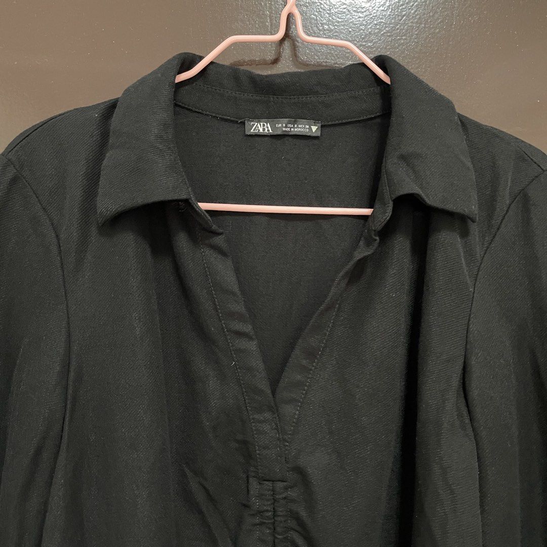 Zara Black Ruched Collared Long Sleeve Top (Category: Longsleeves) located in Pasay City. Submitted by lovedbyzea (Listing ID 1467341542, Image 3). Description: - Brand: Zara - Size: Small (S) - Color: Black - Style: Long sleeve top with collar and V-neckline - Details: Ruched center front with adjustable drawstrings at the hem - Origin: Made in Morocco - Condition/Fit: Comfortable material with a flattering fit - Versatility: Perfect basic for c