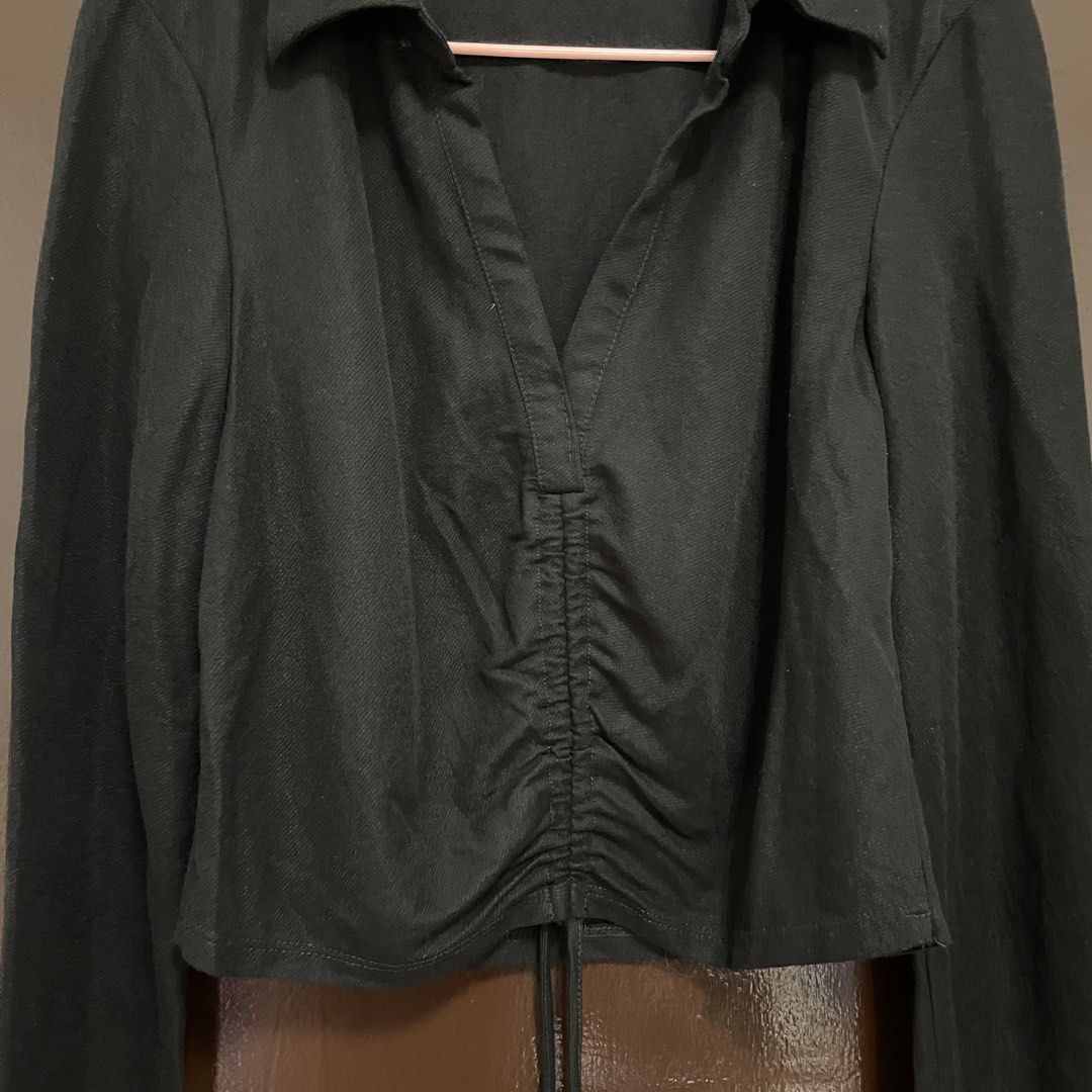 Zara Black Ruched Collared Long Sleeve Top (Category: Longsleeves) located in Pasay City. Submitted by lovedbyzea (Listing ID 1467341542, Image 2). Description: - Brand: Zara - Size: Small (S) - Color: Black - Style: Long sleeve top with collar and V-neckline - Details: Ruched center front with adjustable drawstrings at the hem - Origin: Made in Morocco - Condition/Fit: Comfortable material with a flattering fit - Versatility: Perfect basic for c