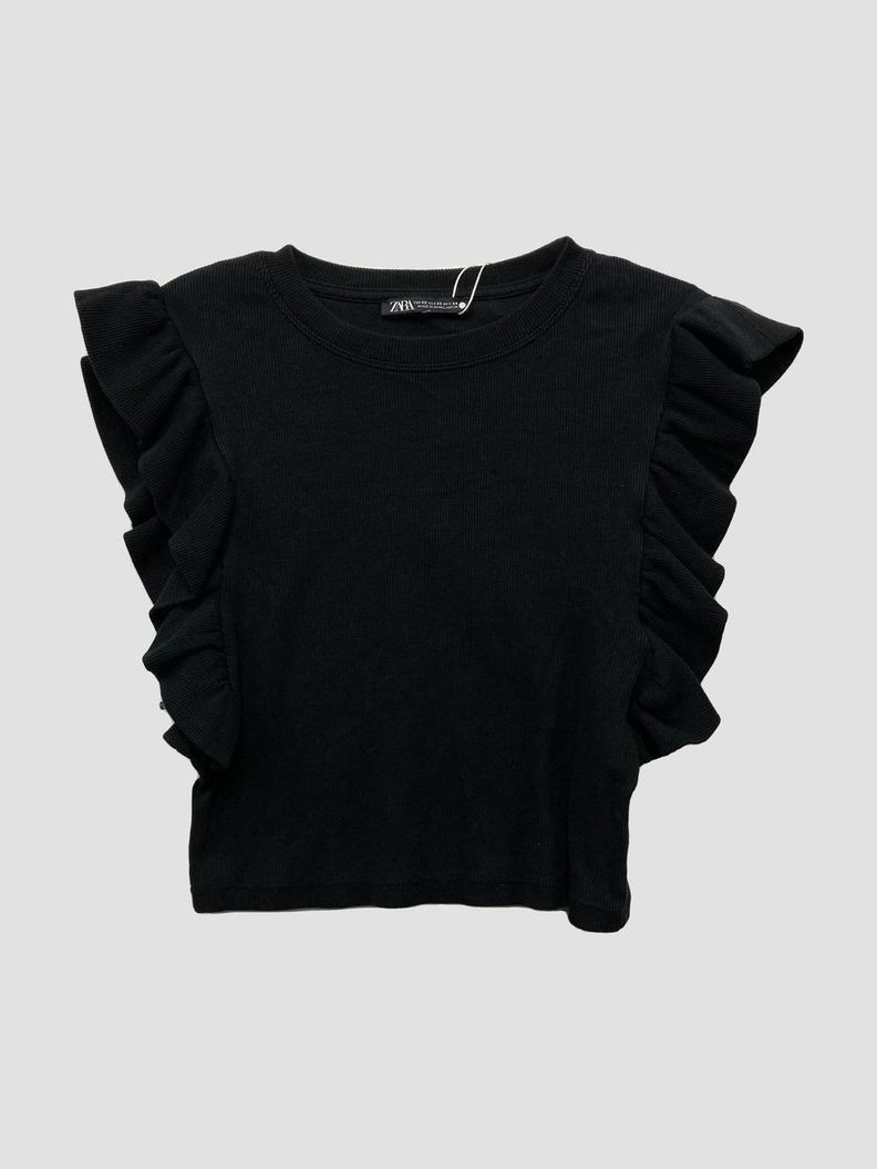 Zara Black Ruffle Sleeve Ribbed Top (Category: Sleeveless) located in Quezon City. Submitted by khsells (Listing ID 1467236268, Image 1). Description: - Brand: Zara - Condition: Brand new with tags attached - Color: Classic black - Style: Ribbed top with statement ruffle sleeves - Fit: Round neckline, short cropped length, and stretchy fabric - Versatility: Easy to pair with high-waisted jeans or skirts.