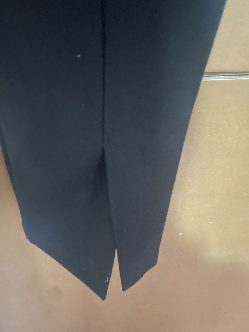 Zara Black Split Hem Trousers Medium (Category: Jeans) located in Manila. Submitted by mochi_dear (Listing ID 1467200988, Image 3). Description: - Brand: Zara - Size: M (True to size) - Color: Black - Fit: High-rise waist and slim leg cut - Feature: Chic split hem detail at the bottom - Origin: Made in Myanmar - Style: Versatile basic, easy to dress up for work or down for casual outings.
