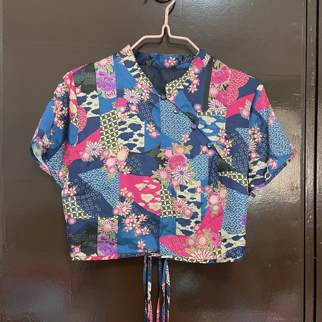 Zara Blue Floral Patchwork Chinese Collar Crop Top Tie Back (Category: Sleeveless) located in Pasay City. Submitted by lovedbyzea (Listing ID 1467343693, Image 1). Description: - Zara but cut tag - Style: Blue crop top with pink floral and patchwork prints - Design: Traditional mandarin collar, short sleeves, and slanted front button closure - Back Details: Open-back design with adjustable tie strings at the hem - Material: Lightweight and comfor