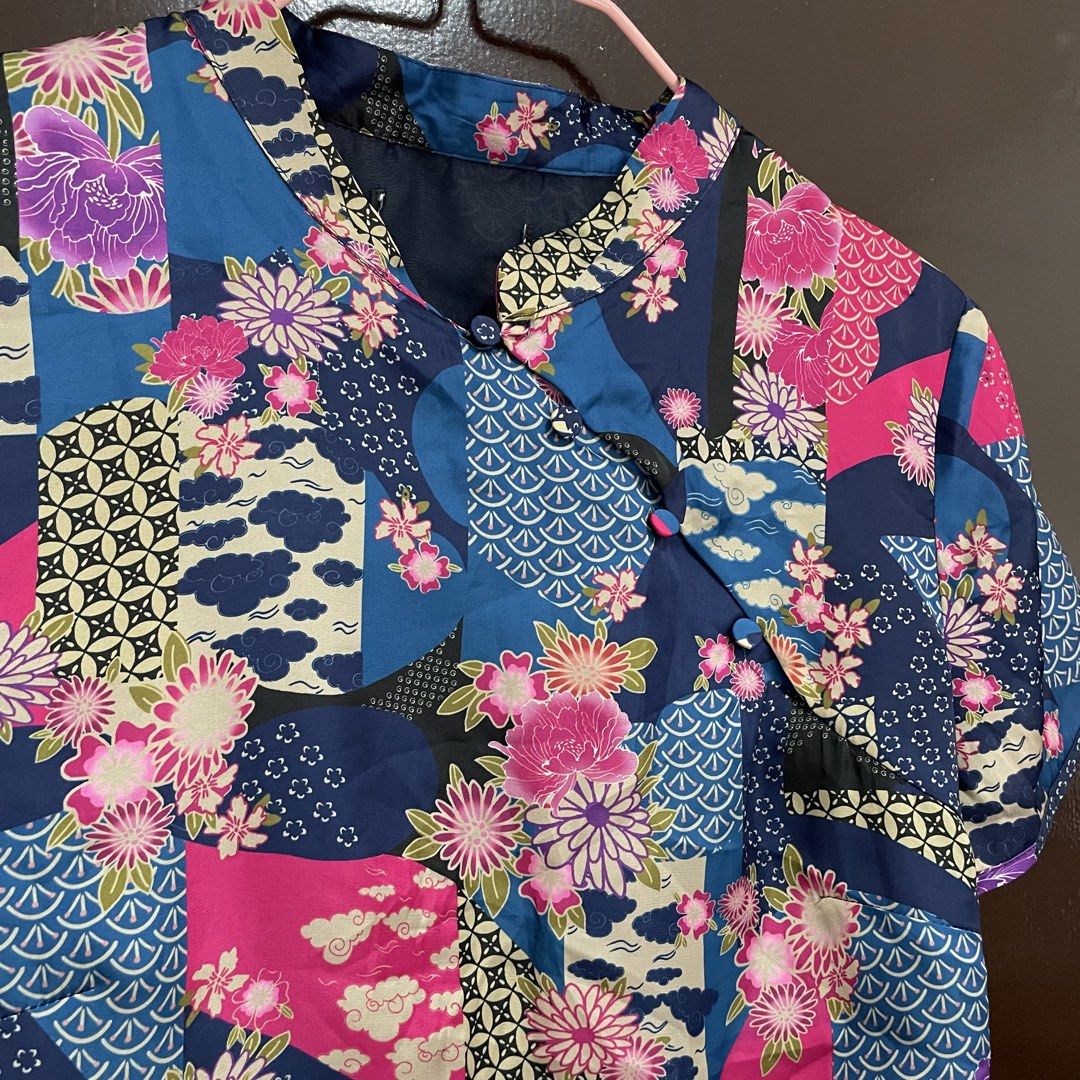 Zara Blue Floral Patchwork Chinese Collar Crop Top Tie Back (Category: Sleeveless) located in Pasay City. Submitted by lovedbyzea (Listing ID 1467343693, Image 3). Description: - Zara but cut tag - Style: Blue crop top with pink floral and patchwork prints - Design: Traditional mandarin collar, short sleeves, and slanted front button closure - Back Details: Open-back design with adjustable tie strings at the hem - Material: Lightweight and comfor