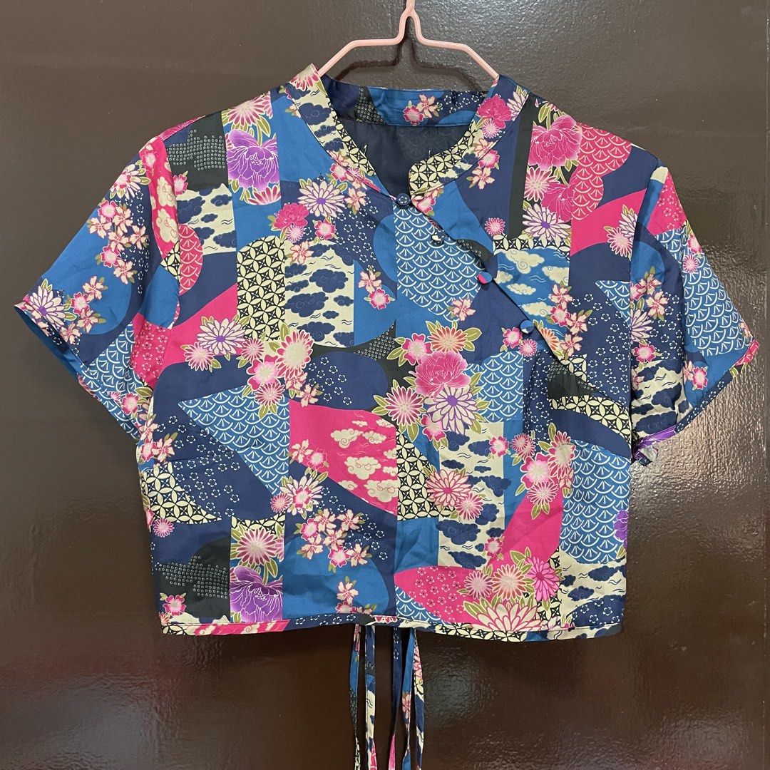 Zara Blue Floral Patchwork Chinese Collar Crop Top Tie Back (Category: Sleeveless) located in Pasay City. Submitted by lovedbyzea (Listing ID 1467343693, Image 2). Description: - Zara but cut tag - Style: Blue crop top with pink floral and patchwork prints - Design: Traditional mandarin collar, short sleeves, and slanted front button closure - Back Details: Open-back design with adjustable tie strings at the hem - Material: Lightweight and comfor