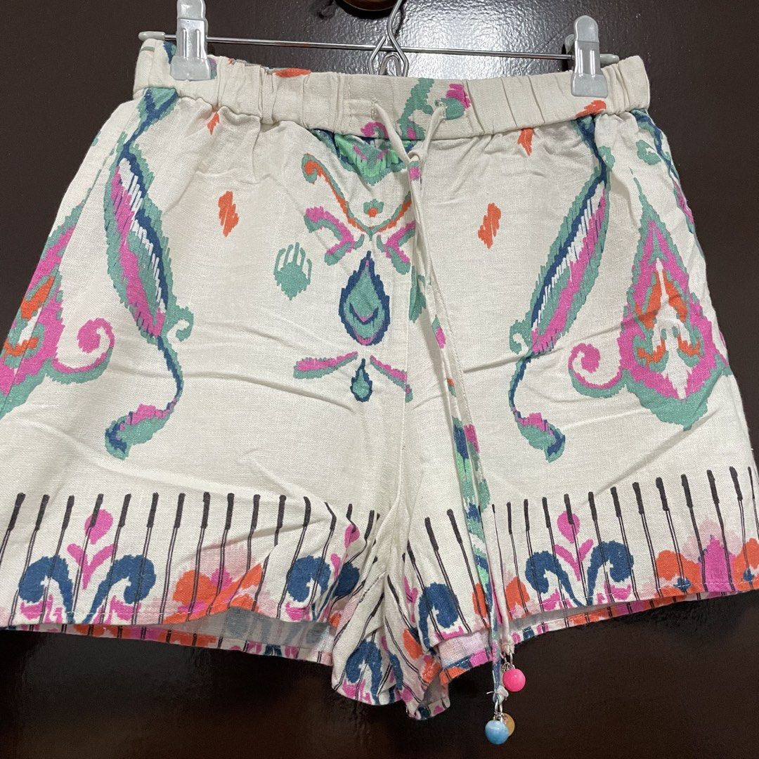 Zara Boho Printed Drawstring Shorts with Beaded Tassels (Category: Shorts) located in Pasay City. Submitted by lovedbyzea (Listing ID 1467344279, Image 3). Description: - Style: Fun, breezy boho shorts - Color/Pattern: Cream base with colorful pink, blue, and orange paisley print - Waistband: Comfortable elastic with adjustable drawstring and beaded charms - Fabric: Light, airy, and perfect for warm weather - Details: Cute patterned hem border, e