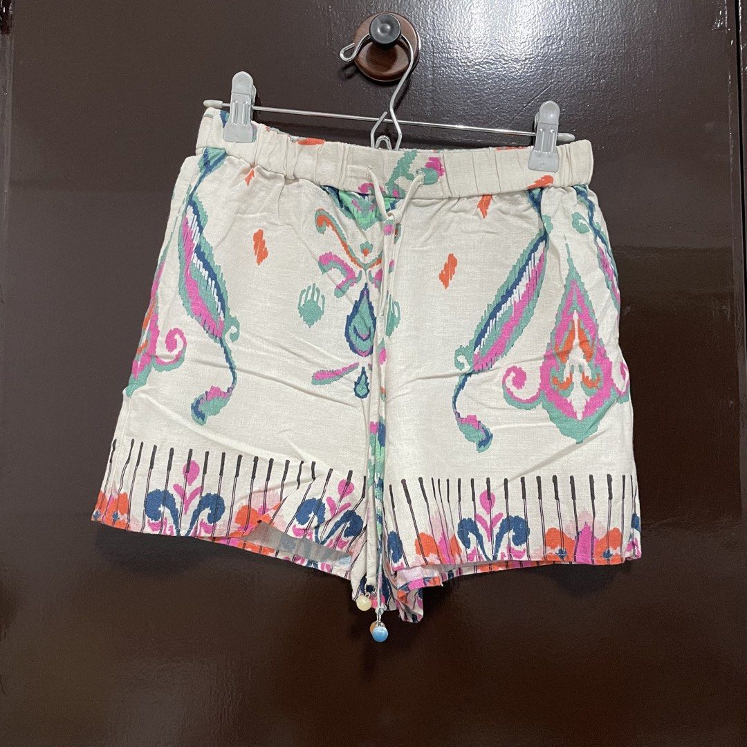 Zara Boho Printed Drawstring Shorts with Beaded Tassels (Category: Shorts) located in Pasay City. Submitted by lovedbyzea (Listing ID 1467344279, Image 1). Description: - Style: Fun, breezy boho shorts - Color/Pattern: Cream base with colorful pink, blue, and orange paisley print - Waistband: Comfortable elastic with adjustable drawstring and beaded charms - Fabric: Light, airy, and perfect for warm weather - Details: Cute patterned hem border, e