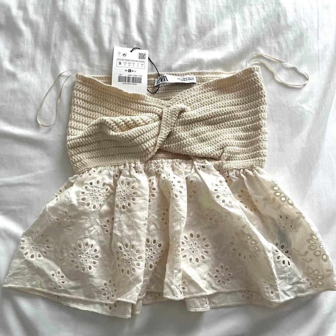 zara contrast knit (Category: Sleeveless) located in Pagsanjan. Submitted by decluttersaur (Listing ID 1467315084, Image 1). Description: Zara twist-front cream bandeau top featuring a ribbed knit bodice with a center cut-out and an eyelet lace peplum hem also available in black no ww size xs no tags bank transfer mop.