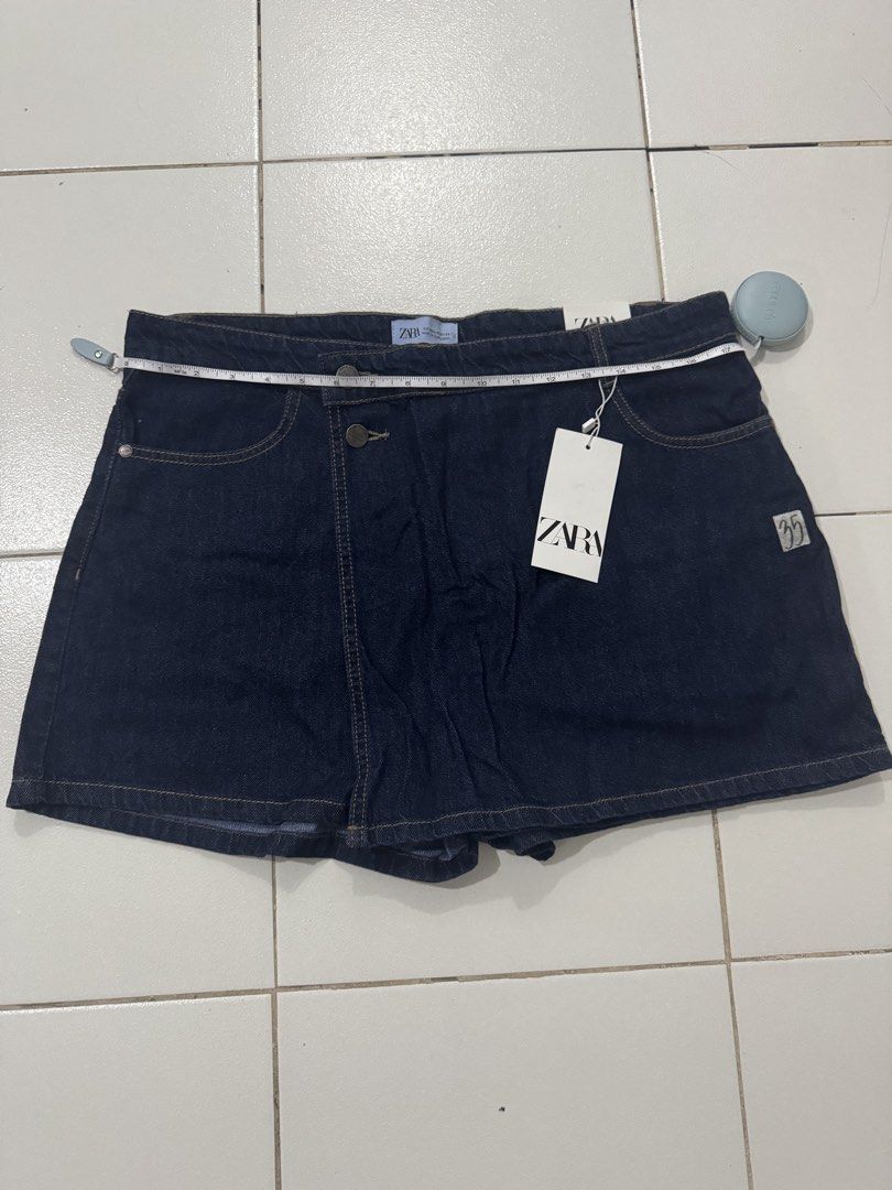 ZARA Dark Blue Denim Skort (Category: Shorts) located in Pasig City. Submitted by pmlmri (Listing ID 1467355467, Image 1). Description: - Brand: ZARA - Wash: Dark blue - Condition: Brand new with original tags attached (unworn) - Size: fits 30-34” inches Mode of Shipping: J&T or Lalmove or Grab express Mode of Payment: Gotyme/BPI/Gcash .