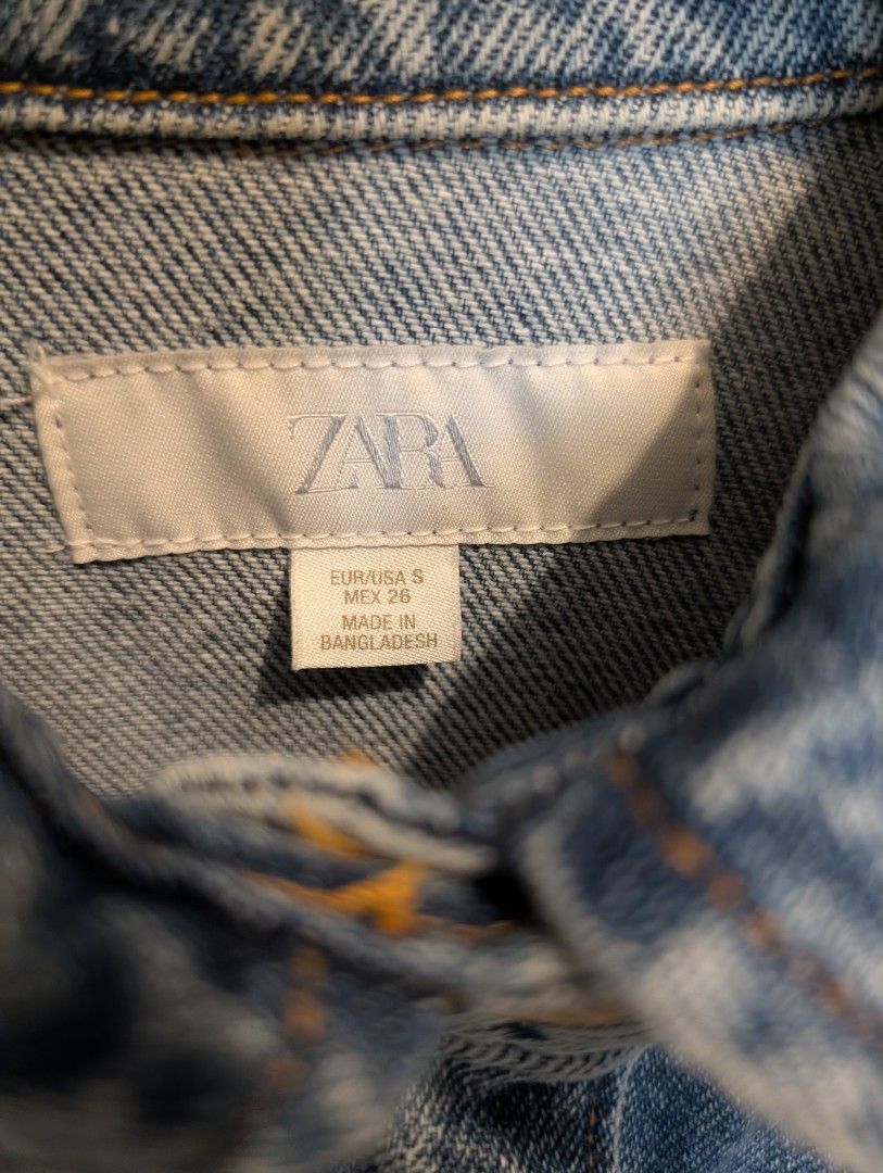 Zara Womens Denim Jacket Oversized Light Wash (Category: Coats, Jackets and Outerwear) located in Manila. Submitted by cart_rd (Listing ID 1467201953, Image 3). Description: - Brand: Zara - Size: S (EUR/USA sizing) - Color: Light wash blue - Fit: Boxy fit with dropped shoulders - Details: Button-up front, metallic logo buttons, two large front patch pockets, and back yoke pleats - Material: denim - Condition: Excellent, ideal layering piece - lig