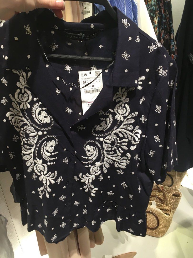 Zara Embroidered Peplum Blouse (Category: Blouses) located in Davao. Submitted by theresetshelf (Listing ID 1467231448, Image 1). Description: Beautiful short-sleeve button-down shirt from Zara Woman. Features gorgeous white floral/paisley contrast embroidery, a flattering V-neck collar, and a cute ruffled peplum hem. Lightweight and perfect for casual wear or dressing up!.