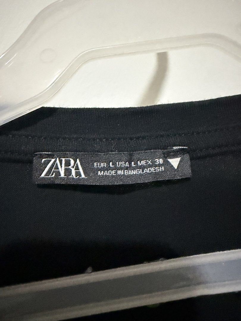 Zara Front Knot T-shirt Bundle Black White Size L (Category: Shirts) located in Mandaluyong City. Submitted by shopria0116 (Listing ID 1467285039, Image 3). Description: - Set of 2 Zara t-shirts (Black and White) - Size: Large (Made in Bangladesh) - Design: Classic crew neck, short sleeves, and trendy front knot detail at the hem - Material: Comfortable everyday fabric - Styling: Easy to pair with jeans or skirts for casual daily outfits - Bundle