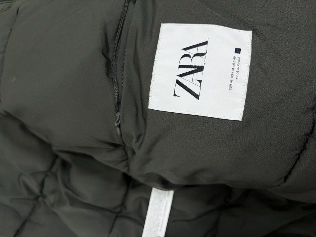 ZARA HIGH NECK PUFFER JACKET (Category: Coats, Jackets and Outerwear) located in Cavite. Submitted by frankiemnla (Listing ID 1467324969, Image 3). Description: L- 29 W- 26 Size- L to XXL Excellent condition It features a water-repellent or matte technical fabric finish, an insulated double collar design, hidden front zipper closure, and ribbed elastic cuffs..