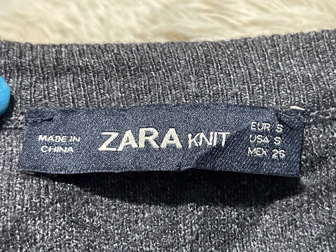 Zara Knit Grey Short Sleeve Sweater (Category: Blouses) located in Donsol. Submitted by saksthriftavenuebyluckymaria8 (Listing ID 1467355229, Image 3). Description: - Brand: Zara - Item: Knit short sleeve sweater - Color: Grey - Size: S (tag attached) - Design: Classic crew neckline with ribbed collar, cuffs, and hem - Material: Soft knit fabric - Condition: Clean, excellent, ready to wear - Versatile piece great for layering or standalone wear Z