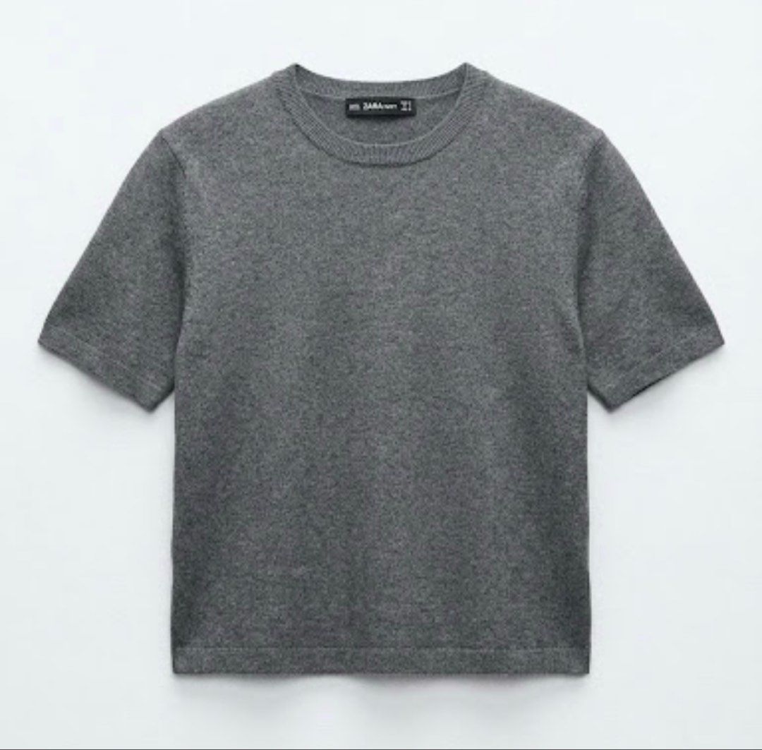 Zara Knit Grey Short Sleeve Sweater (Category: Blouses) located in Donsol. Submitted by saksthriftavenuebyluckymaria8 (Listing ID 1467355229, Image 2). Description: - Brand: Zara - Item: Knit short sleeve sweater - Color: Grey - Size: S (tag attached) - Design: Classic crew neckline with ribbed collar, cuffs, and hem - Material: Soft knit fabric - Condition: Clean, excellent, ready to wear - Versatile piece great for layering or standalone wear Z