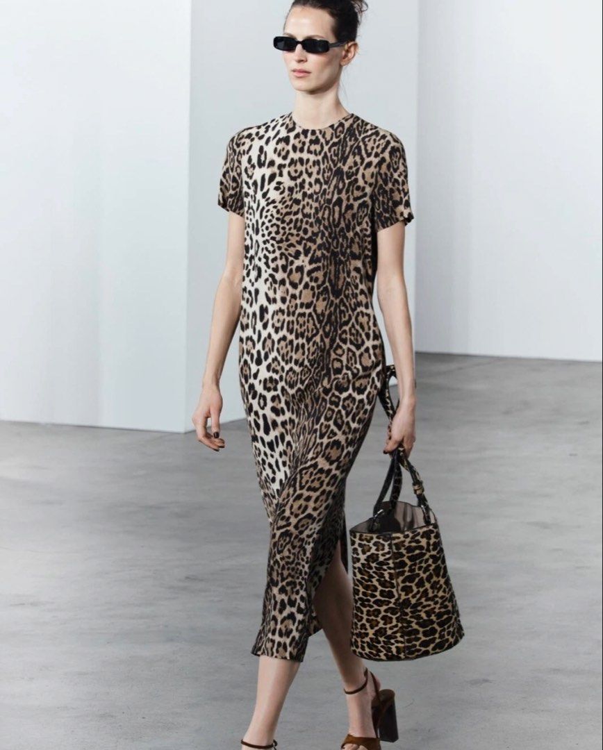 Zara Leopard Print Midi Dress (Category: Dresses) located in Makati City. Submitted by agl.ph (Listing ID 1467359819, Image 1). Description: - Brand: Zara - Style: Midi dress in leopard print - Details: Short sleeves, round neckline, back zip closure - Size: S - Condition: Brand new with original tags attached - Origin: Made in Morocco - Versatility: Easy to dress up or down for any day out.
