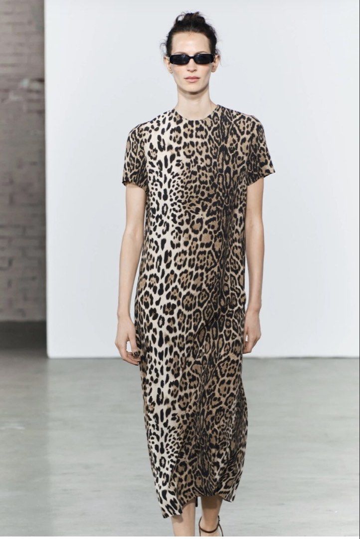 Zara Leopard Print Midi Dress (Category: Dresses) located in Makati City. Submitted by agl.ph (Listing ID 1467359819, Image 3). Description: - Brand: Zara - Style: Midi dress in leopard print - Details: Short sleeves, round neckline, back zip closure - Size: S - Condition: Brand new with original tags attached - Origin: Made in Morocco - Versatility: Easy to dress up or down for any day out.