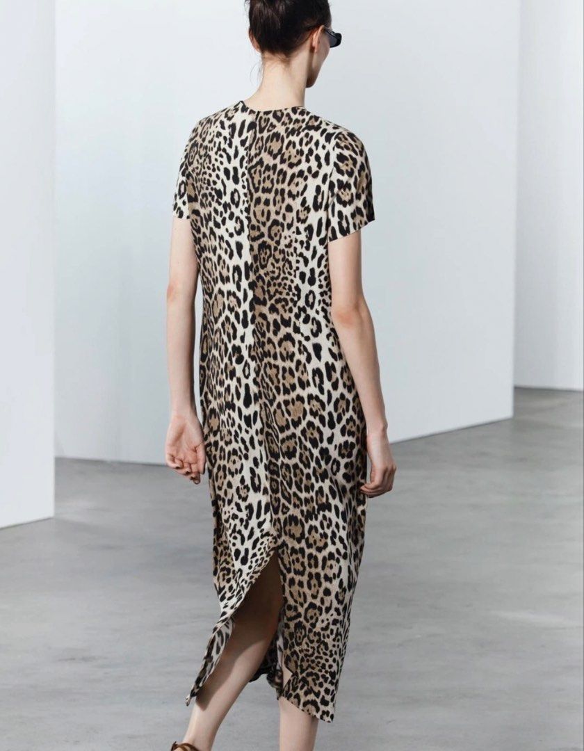 Zara Leopard Print Midi Dress (Category: Dresses) located in Makati City. Submitted by agl.ph (Listing ID 1467359819, Image 2). Description: - Brand: Zara - Style: Midi dress in leopard print - Details: Short sleeves, round neckline, back zip closure - Size: S - Condition: Brand new with original tags attached - Origin: Made in Morocco - Versatility: Easy to dress up or down for any day out.