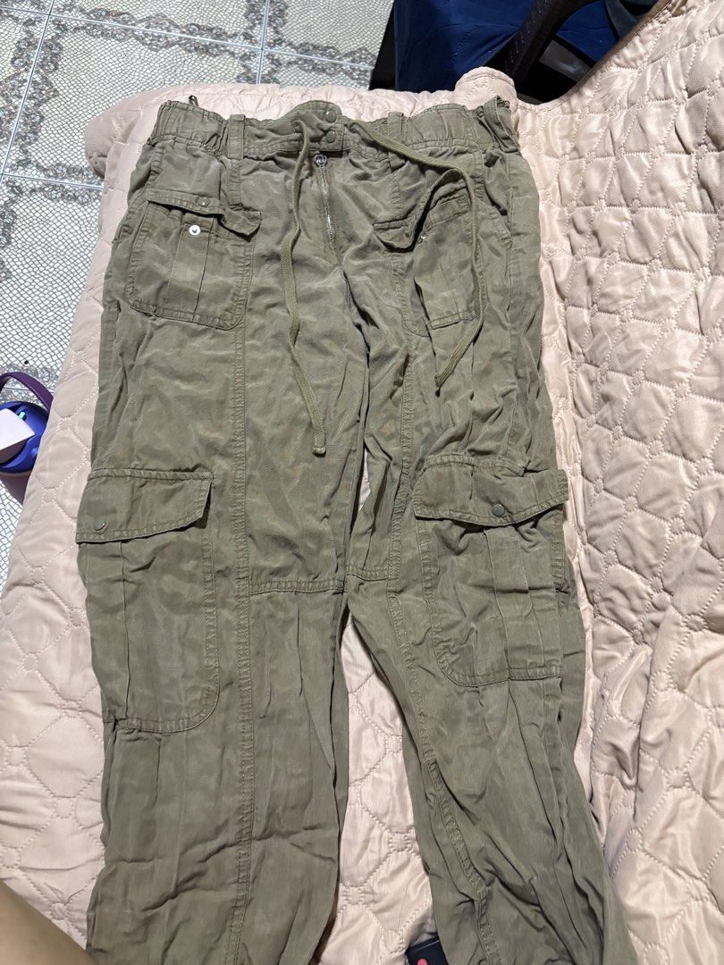 ZARA Olive Green Cargo Pants (Category: Jeans) located in Quezon City. Submitted by jinnysells (Listing ID 1467350372, Image 1). Description: - Size: L - Waist: Elastic waistband with drawstring tie and zipper fly - Fit: Relaxed utility style - Pockets: Multiple utility pockets on front, sides, and back (8 pockets) - length: 35 inches.