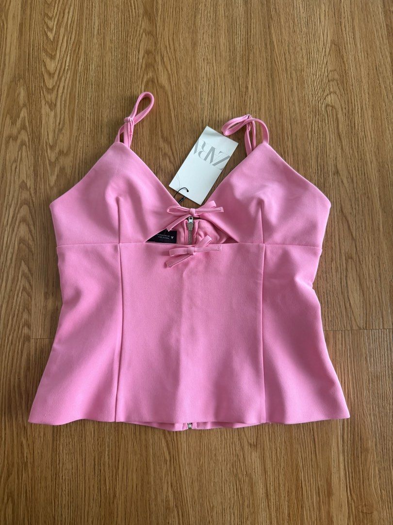 Zara Pink Top with Bows and Zip Back Size M (Category: Sleeveless) located in Quezon City. Submitted by morgan_rysblk (Listing ID 1467181992, Image 1). Description: - Brand: Zara - Size: Medium - Color: Bright Pink - Condition: Brand new with original store tag attached - Too big for a size S girlie - Bought it for Php 1995.