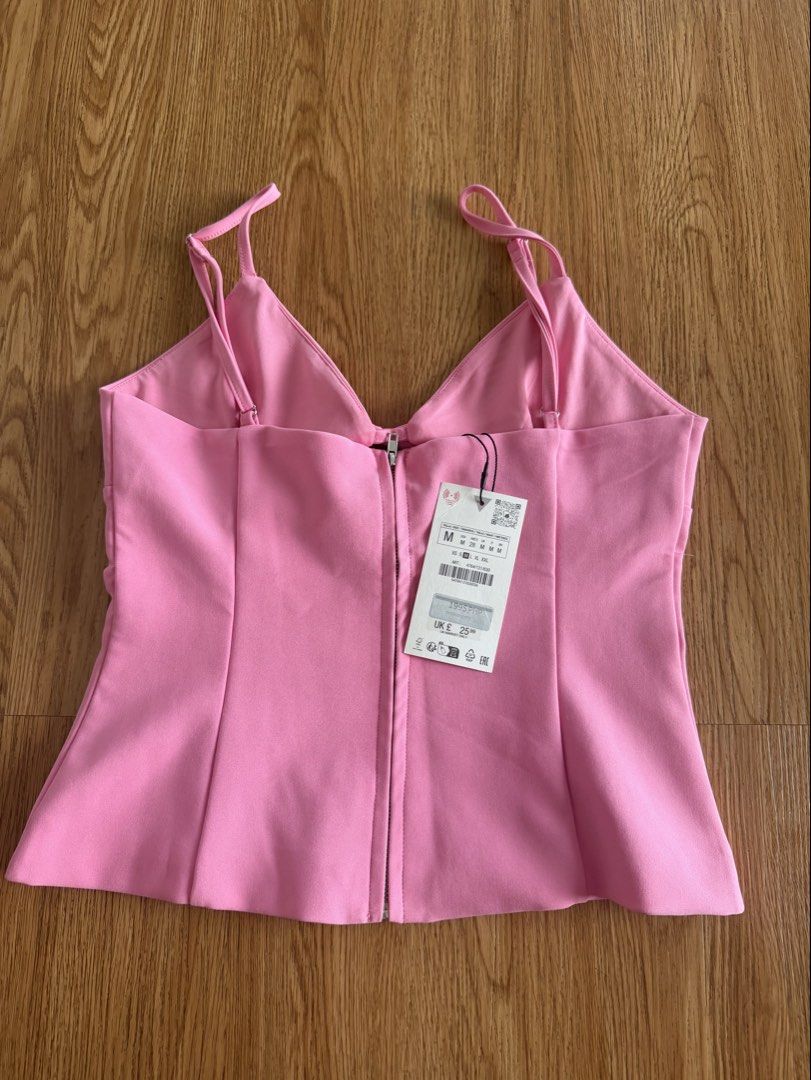 Zara Pink Top with Bows and Zip Back Size M (Category: Sleeveless) located in Quezon City. Submitted by morgan_rysblk (Listing ID 1467181992, Image 2). Description: - Brand: Zara - Size: Medium - Color: Bright Pink - Condition: Brand new with original store tag attached - Too big for a size S girlie - Bought it for Php 1995.