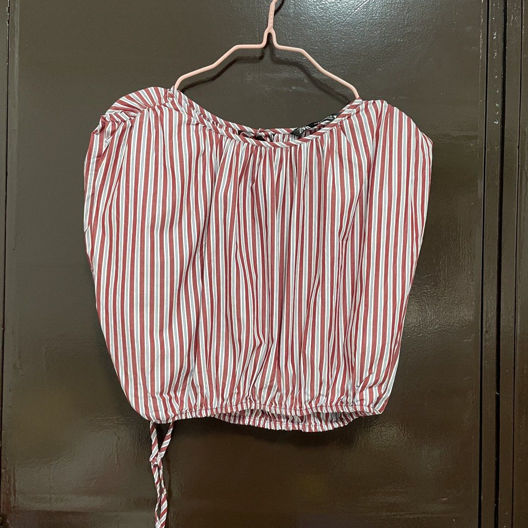 Zara Red and White Striped Blouse Size S (Category: Blouses) located in Pasay City. Submitted by lovedbyzea (Listing ID 1467343492, Image 1). Description: - Brand: Zara - Size: S (EUR S, USA S, MEX 26) - Color: Red, white, and blue stripes - Material: Lightweight cotton (Made in Morocco) - Design: Short sleeves, boat neckline with back tie closure - Detail: Elastic hem with adjustable drawstring tie.