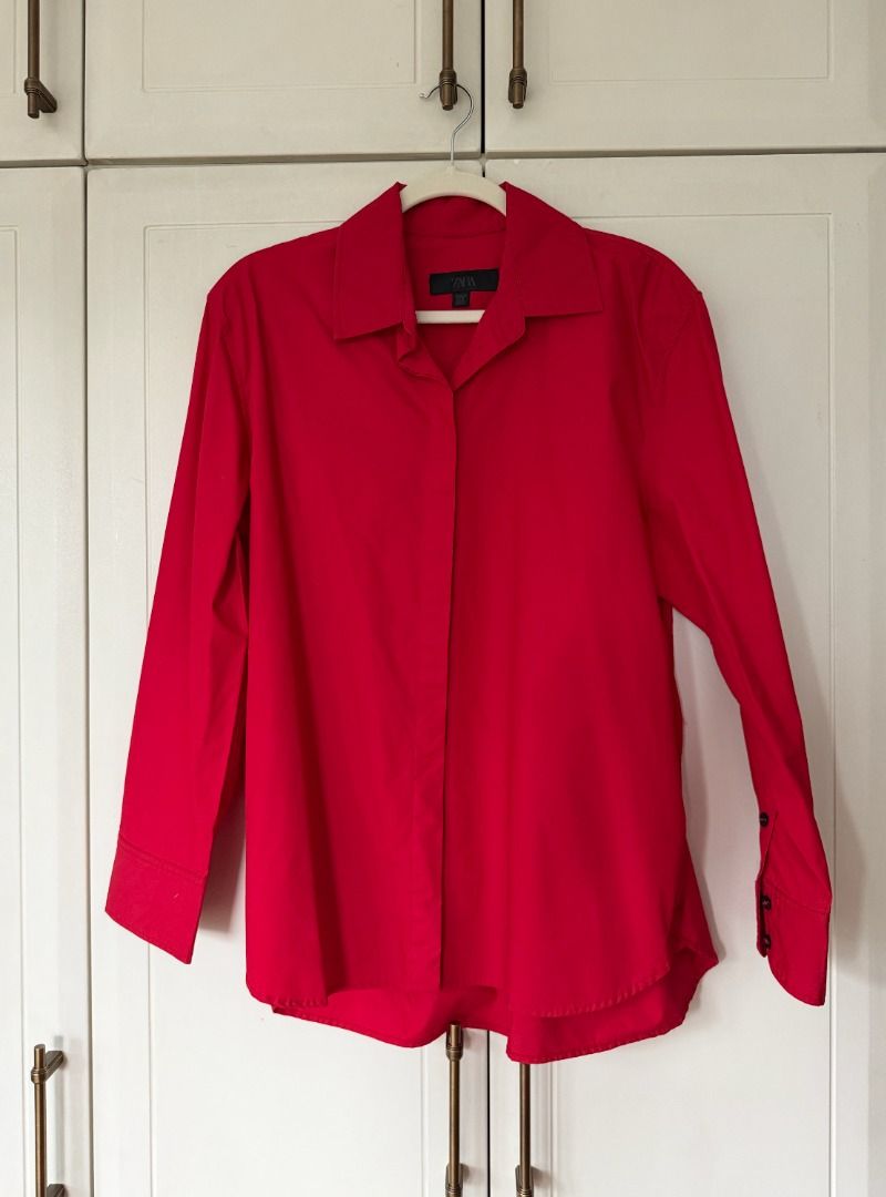 Zara Red Button Up Shirt (Category: Shirts) located in Caloocan City. Submitted by belizalde4 (Listing ID 1467212208, Image 1). Description: - Brand: Zara - Size: M - Color: Bright red - Origin: Made in Morocco - Details: Collared neckline, long sleeves, button cuffs - Condition: Clean, solid color design - Style: Versatile, easy to dress up or down.