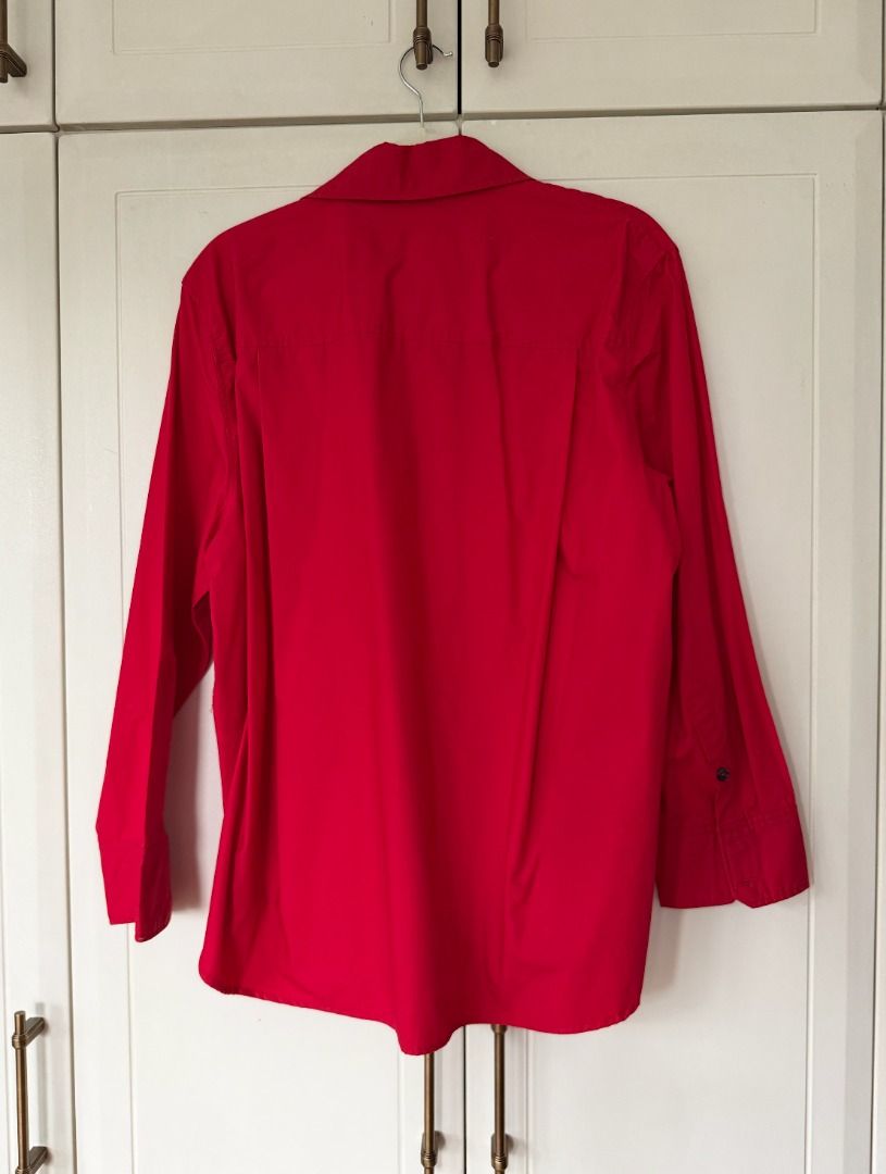 Zara Red Button Up Shirt (Category: Shirts) located in Caloocan City. Submitted by belizalde4 (Listing ID 1467212208, Image 2). Description: - Brand: Zara - Size: M - Color: Bright red - Origin: Made in Morocco - Details: Collared neckline, long sleeves, button cuffs - Condition: Clean, solid color design - Style: Versatile, easy to dress up or down.