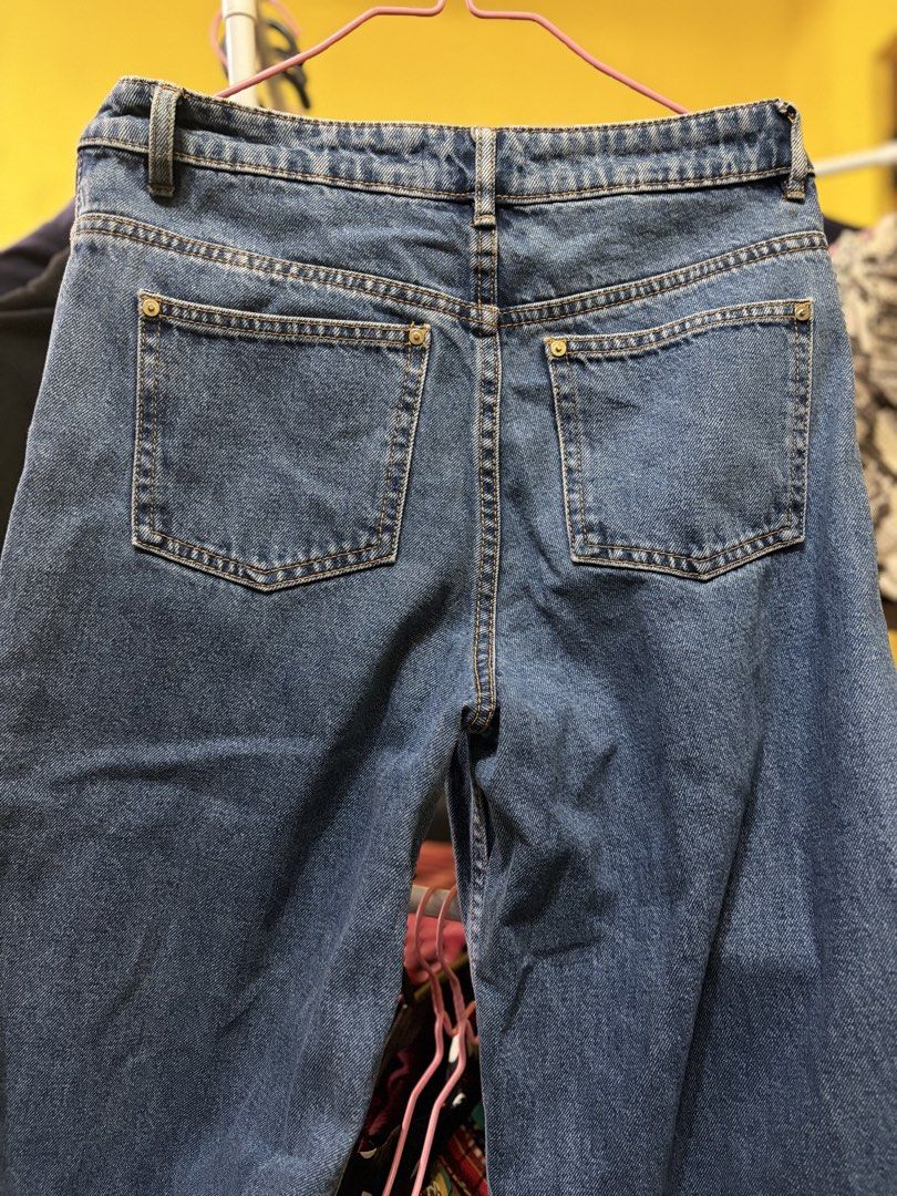 Zara TRF Blue Denim Jeans (Category: Jeans) located in Calamba. Submitted by handpickedbynetty (Listing ID 1467224187, Image 3). Description: - Brand: Zara TRF - Style: High-waisted blue denim jeans with raw, frayed ankle hems - Closure: Front button and zipper - Pockets: Classic front and back pockets - Size: EUR 32, USA 00, MEX 22 - Made in: Bangladesh - Condition: Preloved, well-kept from personal closet (no longer fits).
