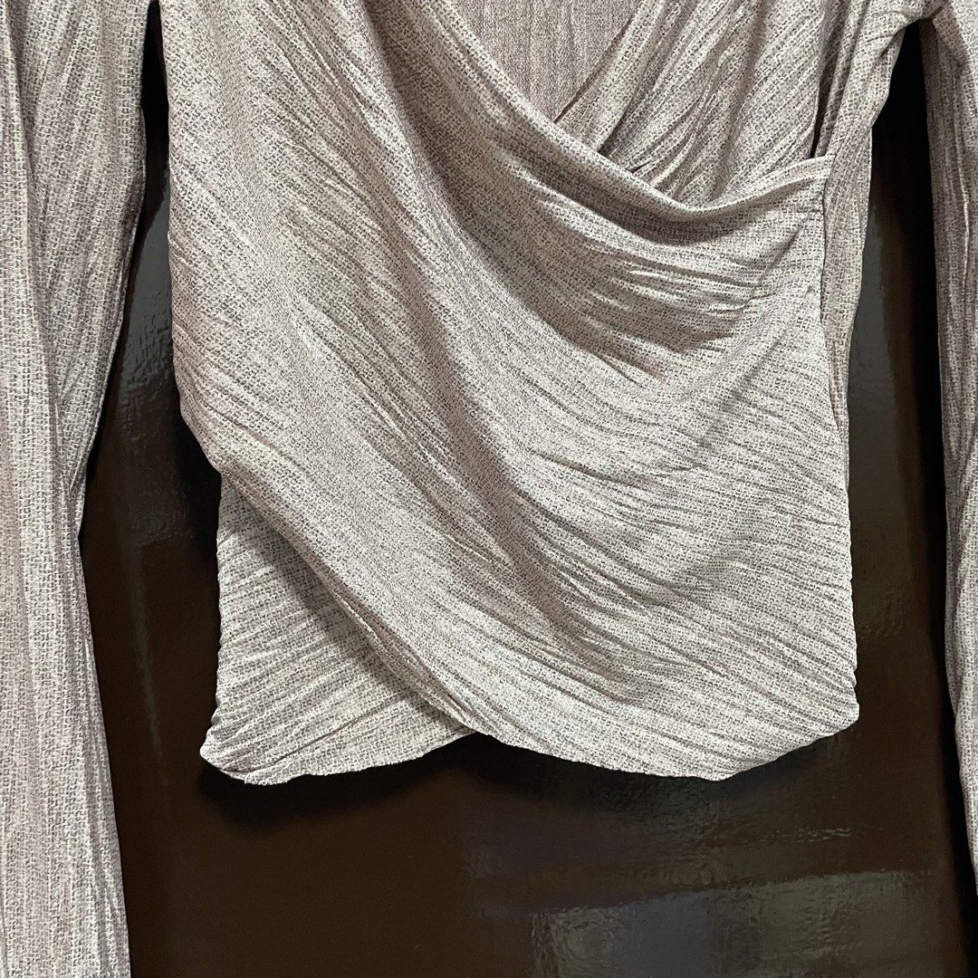 Zara W/B Collection V-Neck Wrap Top (Category: Blouses) located in Pasay City. Submitted by lovedbyzea (Listing ID 1467340761, Image 3). Description: - Brand: Zara (W/B Collection) - Size: M (EUR/USA) - Color: Beige - Material: Textured ribbed fabric - Design: Crossover V-neck wrap front with draped detailing - Origin: Made in Portugal - Condition/Use: Great versatile piece for casual wear or nights out.