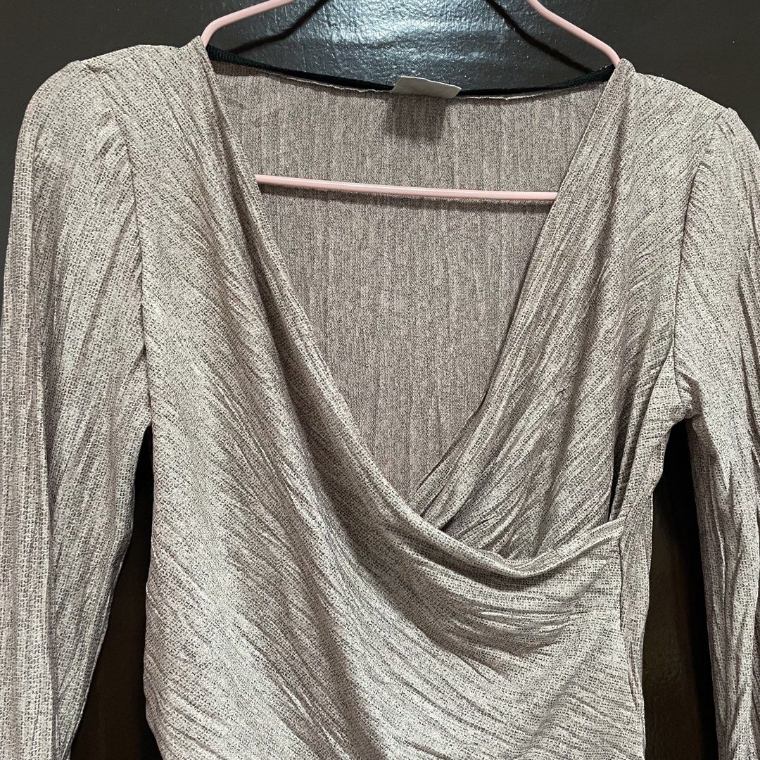 Zara W/B Collection V-Neck Wrap Top (Category: Blouses) located in Pasay City. Submitted by lovedbyzea (Listing ID 1467340761, Image 2). Description: - Brand: Zara (W/B Collection) - Size: M (EUR/USA) - Color: Beige - Material: Textured ribbed fabric - Design: Crossover V-neck wrap front with draped detailing - Origin: Made in Portugal - Condition/Use: Great versatile piece for casual wear or nights out.