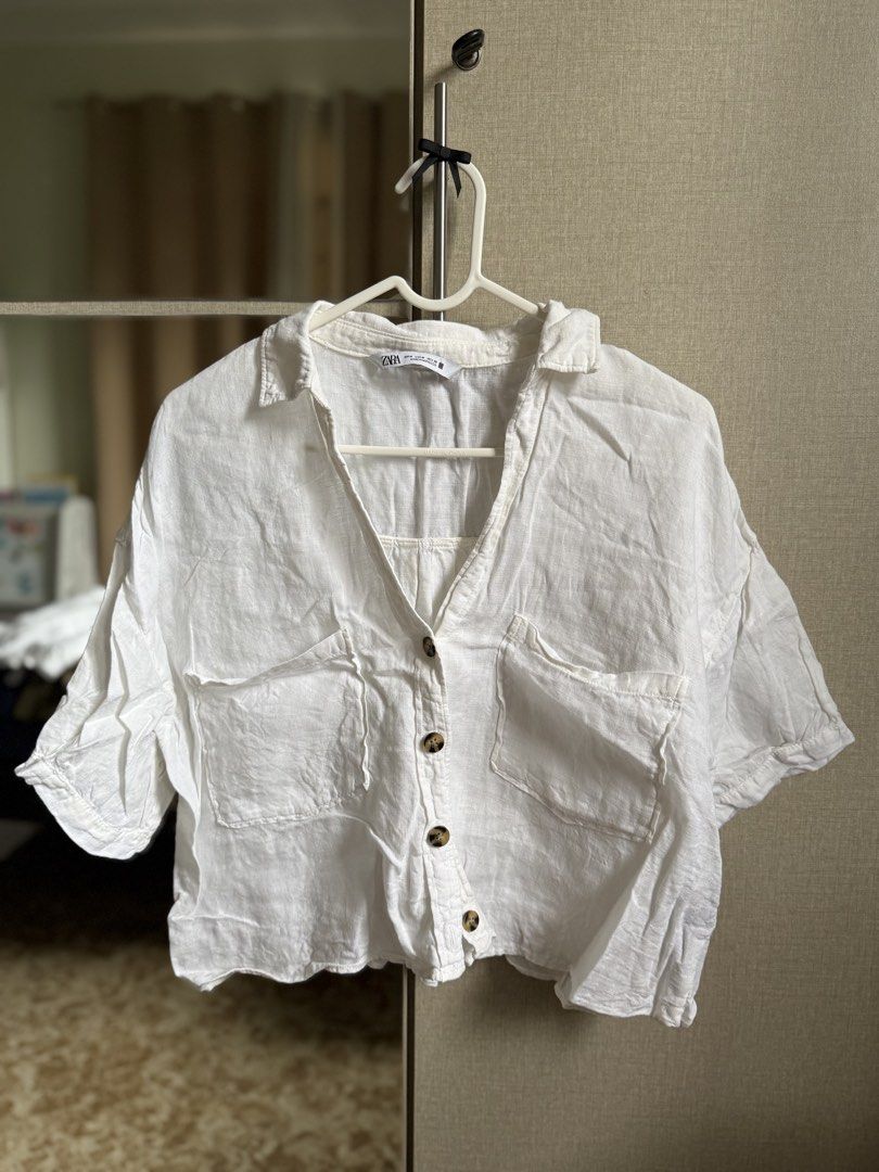 Zara White Linen Top (Category: Shirts) located in Angeles City. Submitted by decluttering.kimmmyyy (Listing ID 1467232715, Image 1). Description: ZARA white linen blouse Fit: Cropped and boxy cut Size: Medium.