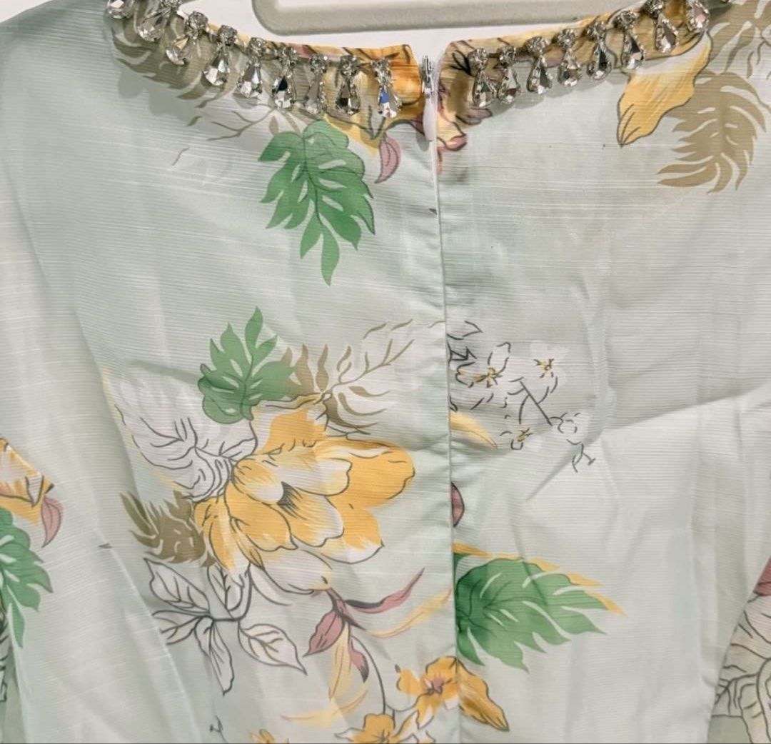Zim Insp Dress (Category: Dresses) located in Manila. Submitted by theopal (Listing ID 1467197387, Image 3). Description: * Sage-green base with a vibrant yellow, red, orange, and white floral and leaf print. * Rounded with a rhinestone-embellished collar. * Long sleeves with gathered shoulders and cuffs. * Fit-and-flare design with a fitted bodice and knee-length A-line skirt. * Cut Tag *color may vary due to lighting.