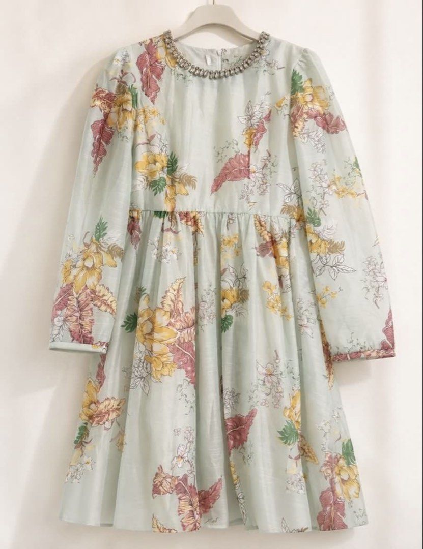 Zim Insp Dress (Category: Dresses) located in Manila. Submitted by theopal (Listing ID 1467197387, Image 2). Description: * Sage-green base with a vibrant yellow, red, orange, and white floral and leaf print. * Rounded with a rhinestone-embellished collar. * Long sleeves with gathered shoulders and cuffs. * Fit-and-flare design with a fitted bodice and knee-length A-line skirt. * Cut Tag *color may vary due to lighting.