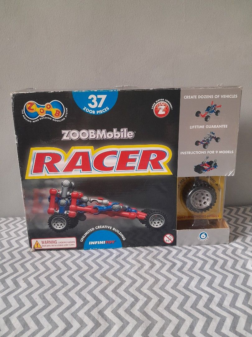 ZOOBMobile Racer (Category: Interactive Toys) located in Pasig City. Submitted by three.babybears (Listing ID 1467269227, Image 1). Description: includes 4 wheels with axles, 4 rubber tires and 35 Zoob pieces (missing 2 zoob pieces and instructions).