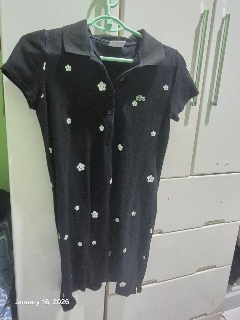 2 pcs LACOSTE Mary Quant japan (Category: Dresses) located in Cavite. Submitted by jannahjasmin (Listing ID 1467379045, Image 1). Description: - Black Lacoste polo shirt - White floral pattern - Classic collar - Short sleeves - Button-down front - Lacoste logo - Regular fit - Perfect for casual wear.