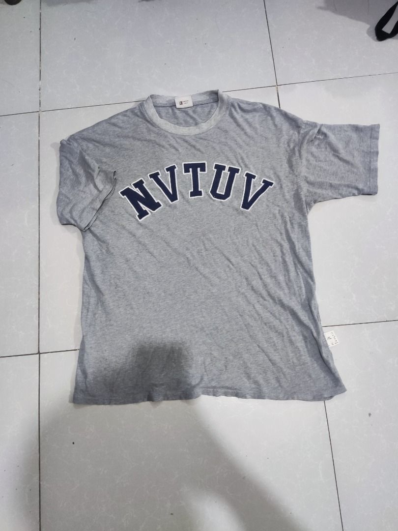 808 Grey Graphic T-Shirt Size L (Category: Tshirts & Polo Shirts ) located in Rizal. Submitted by skilidilidu (Listing ID 1467548420, Image 1). Description: - Brand: 808 - Style: Grey short-sleeve tee with collegiate lettering - Design: Bold 'NVTUV' print in dark blue with white outlining across the chest - Size: L (Tag included) - Details: Ribbed crew neck collar and brand label on the lower side seam - Versatility: Perfect for casual wear, easy