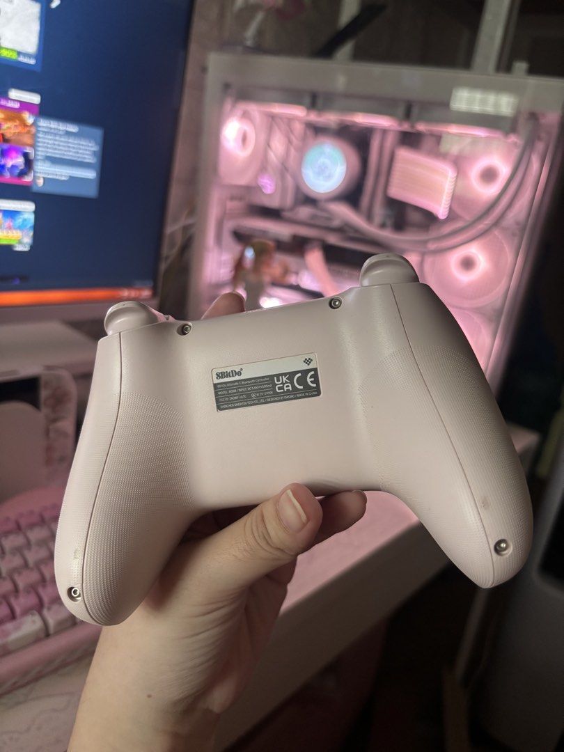 8bitdo Ultimate C Bluetooth Controller 80NB Pastel Pink (Category: Controllers) located in Cavite. Submitted by iyanlabagasan (Listing ID 1467427700, Image 3). Description: - Pastel pink - Compatible via bluetooth with PC but layout is for Switch. Firmware is already updated to be compatible with Switch 2 -Barely used, mostly just stored - Flaws: Chipped Left Stick, Dirt stains on the back of grip. Other than appearance flaws, it works perfectly.