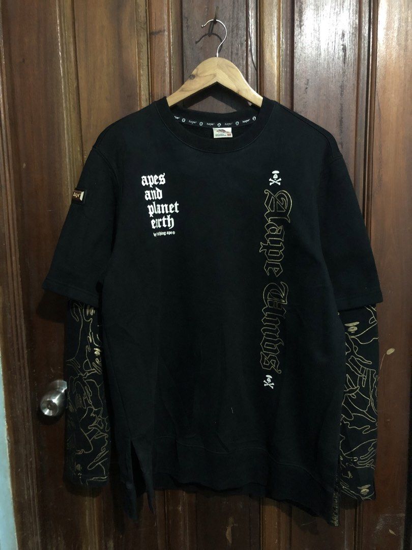 AAPE By A Bathing Ape Black Double Sleeve Sweatshirt (Category: Coats, Jackets and Outerwear) located in Quezon City. Submitted by yeahsource222 (Listing ID 1467530431, Image 1). Description: - Brand: AAPE (By A Bathing Ape) - Color: Black with gold details - Design: Layered short-sleeve overlay on long sleeves - Graphics: Gold foil AAPE text on front, large ape head skull logo on back, and 'apes and planet earth' lettering on chest - Details: Go