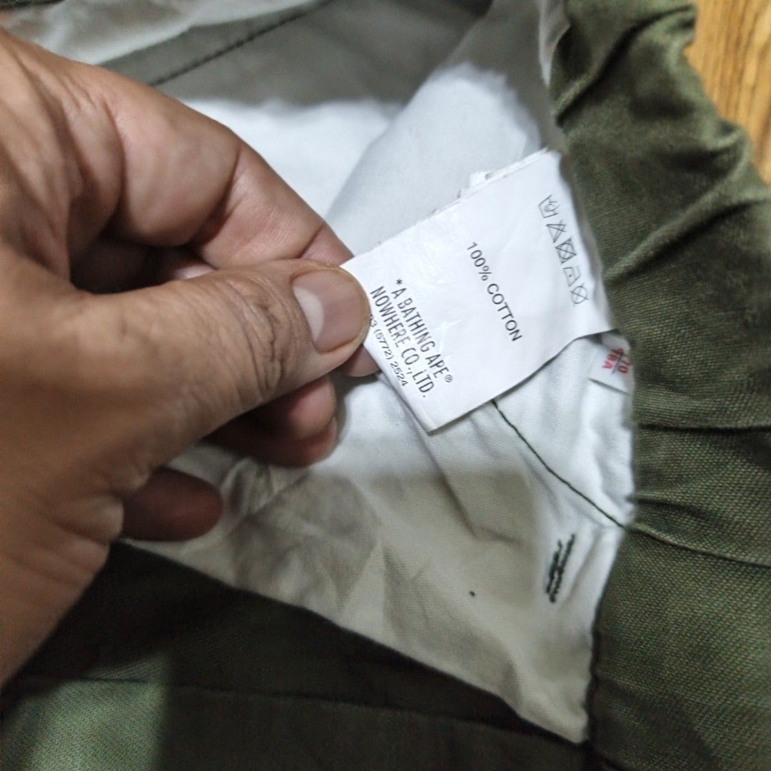 AAPE By A Bathing Ape Green Cargo Pants (Category: Joggers) located in Manila. Submitted by narju1234 (Listing ID 1467370132, Image 3). Description: - Brand: AAPE by A Bathing Ape (Nowhere Co., Ltd.) - Color: Green - Material: 100% Cotton - Waist: Elastic waistband with built-in adjustable belt - Pockets: Multiple leg pockets featuring iconic Ape & Planet Earth patches and text prints - Cuffs: Ribbed ankle cuffs for a secure, tapered fit - Condit