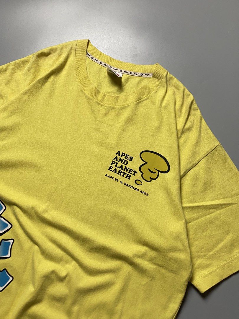 Aape Wrap Around - Size Large-XL (Category: Tshirts & Polo Shirts ) located in Cebu City. Submitted by maicoh230 (Listing ID 1467513770, Image 3). Description: Aape Yellow Tee. Half Wrap Around. ▫️ Condition: 9/10 ▫️ Color: 9/10 ▫️ Size: L-XL ▫️ Dimensions: W23 L29 ▫️ Flaw/s: 🛒 Mine: 800 REMINDERS 📍 Cebu City 💳 Payment First Policy 📦 J&T | Maxim (Within Cebu) 📸 Color may vary slightly due to lighting..