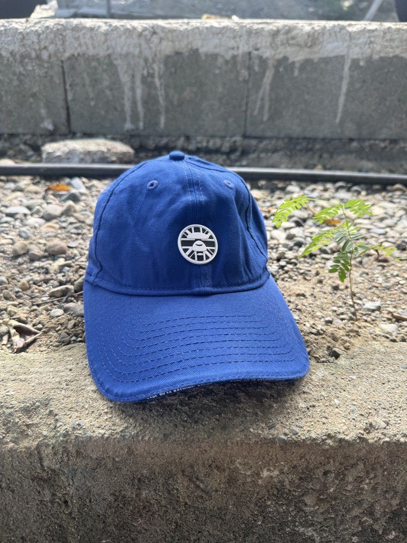 Aape x New Era 9TWENTY Blue Cap (Category: Caps & Hats) located in Burgos, Ilocos Norte. Submitted by copthrift (Listing ID 1467371686, Image 1). Description: - Official Aape x New Era collaboration - Style: Classic 9TWENTY adjustable strapback - Color: Royal Blue cotton - Details: White Aape front logo, New Era side embroidery, and back text branding - Authenticity: Includes original interior tags and brim holographic sticker - Size: One size fi