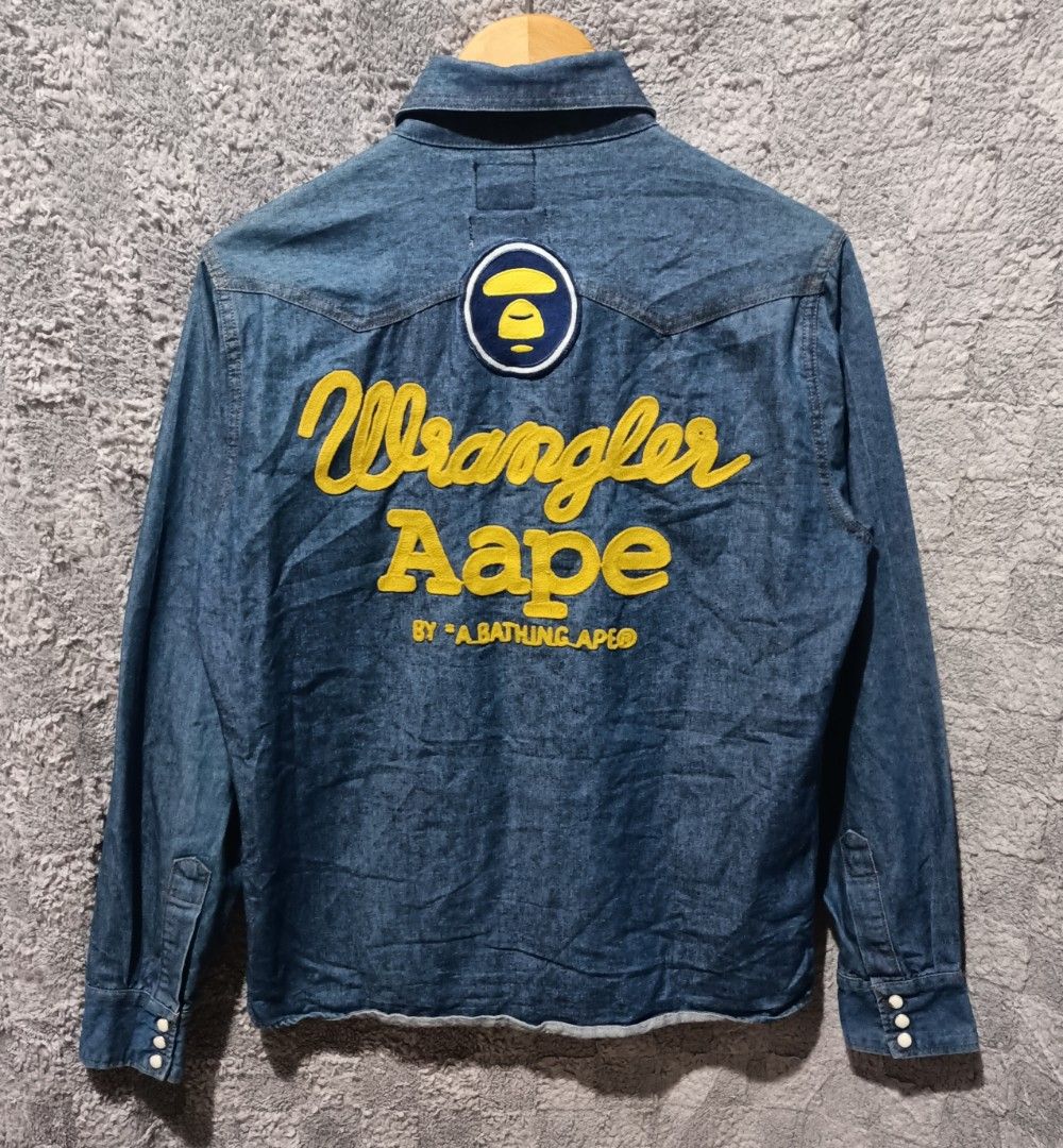Aape x wrangler denim jacket (Category: Coats, Jackets and Outerwear) located in Asingan. Submitted by arnelpalaris8 (Listing ID 1467531767, Image 1). Description: Aape x Wrangler denim Jacket large fit to small frame 20 width 26 Length EXCELLENT CONDITION.