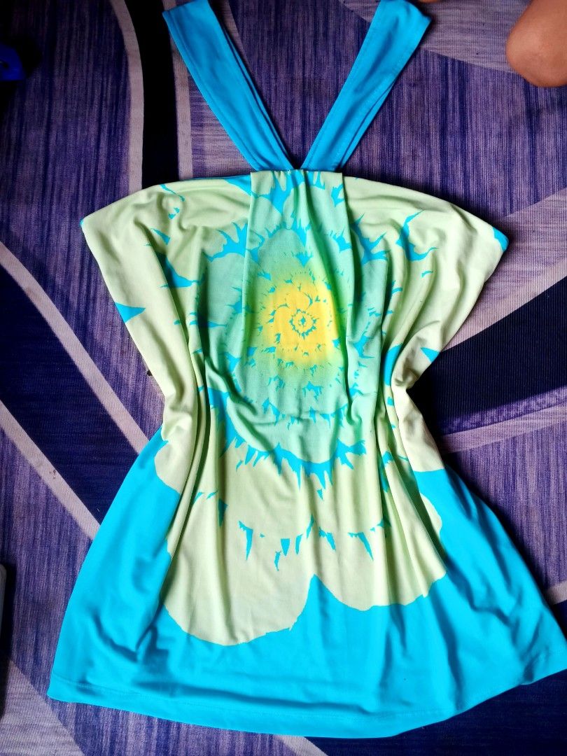 Axcess Y2K (Category: Others Tops) located in Manila. Submitted by icamalicdem29 (Listing ID 1467470440, Image 3). Description: vintage Y2K halter neck top or dress from the brand Axcess (originally a line by Liz Claiborne). It features a distinct bohemian retro look with a large abstract floral/sunburst graphic pattern rendered in a bright turquoise blue, lime green, and sunny yellow color scheme..