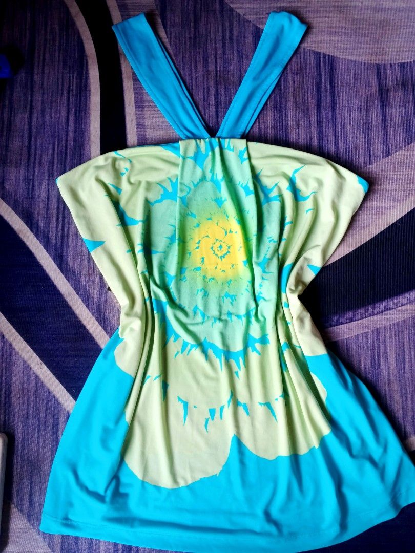 Axcess Y2K (Category: Others Tops) located in Manila. Submitted by icamalicdem29 (Listing ID 1467470440, Image 2). Description: vintage Y2K halter neck top or dress from the brand Axcess (originally a line by Liz Claiborne). It features a distinct bohemian retro look with a large abstract floral/sunburst graphic pattern rendered in a bright turquoise blue, lime green, and sunny yellow color scheme..
