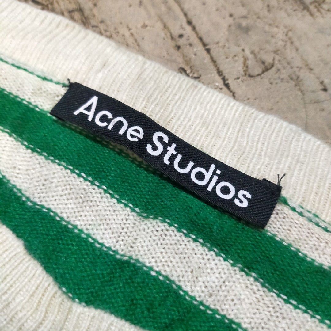Acne Studios Green and White Striped Wool Sweater (Category: Longsleeves) located in Zamboanga. Submitted by _oliverbmth (Listing ID 1467528536, Image 3). Description: - Brand: Acne Studios - Item: Striped wool sweater with signature face patch - Color: Green and white - Size: M - Material: 100% wool - Details: Crew neck, ribbed cuffs and hem - Condition: Warm, cozy, and well-maintained - Origin: Made in China - Dimes 17x25 .