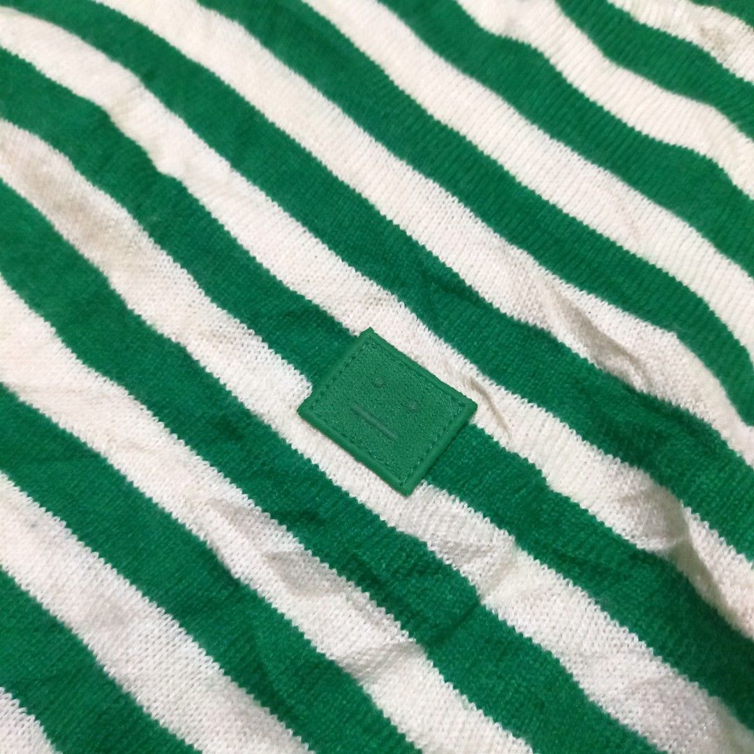 Acne Studios Green and White Striped Wool Sweater (Category: Longsleeves) located in Zamboanga. Submitted by _oliverbmth (Listing ID 1467528536, Image 2). Description: - Brand: Acne Studios - Item: Striped wool sweater with signature face patch - Color: Green and white - Size: M - Material: 100% wool - Details: Crew neck, ribbed cuffs and hem - Condition: Warm, cozy, and well-maintained - Origin: Made in China - Dimes 17x25 .