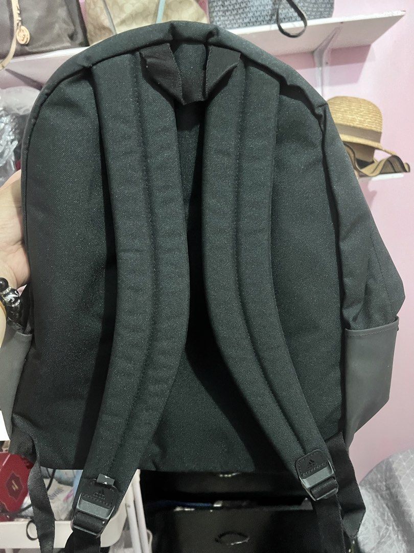 Adidas Black and Gold Backpack (Category: Backpacks) located in Manila. Submitted by cleverstone_21f597 (Listing ID 1467489565, Image 2). Description: - Brand: Adidas - Color: Black with gold logo and dark grey bottom panels - Material: Durable canvas - Compartments: Roomy main compartment and front zip pouch - Features: Adjustable shoulder straps, smooth branded zippers - Condition: Excellent / Ready for daily use - Mode of Payment: GCash, BPI, 