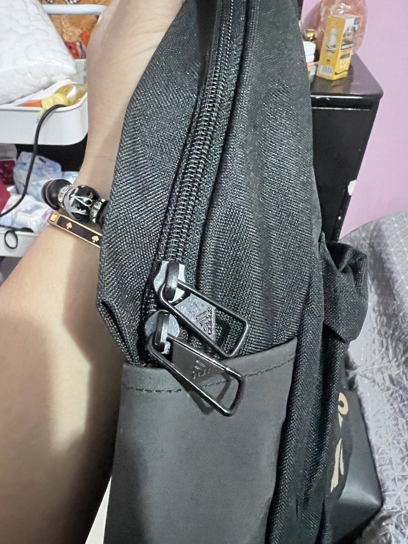 Adidas Black and Gold Backpack (Category: Backpacks) located in Manila. Submitted by cleverstone_21f597 (Listing ID 1467489565, Image 3). Description: - Brand: Adidas - Color: Black with gold logo and dark grey bottom panels - Material: Durable canvas - Compartments: Roomy main compartment and front zip pouch - Features: Adjustable shoulder straps, smooth branded zippers - Condition: Excellent / Ready for daily use - Mode of Payment: GCash, BPI, 