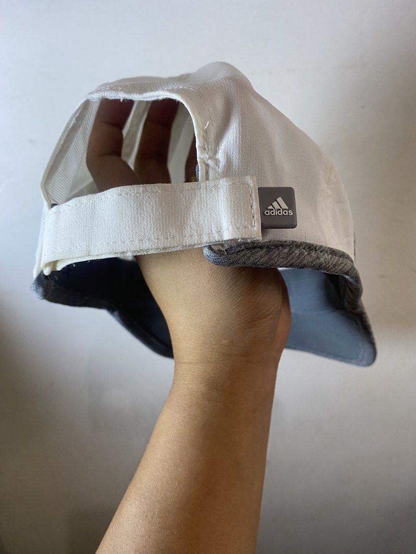 Adidas Climalite White Grey Cap (Category: Caps & Hats) located in Manila. Submitted by kennyfranc39614 (Listing ID 1467516900, Image 3). Description: - Authentic Adidas Cap in white and grey - Climalite technology keeps you dry by wicking away sweat - Curved brim accented with stylish grey trim - Embroidered silver Adidas logo on the front and matching logo patch on the adjustable back strap - Breathable fabric panels on the sides for extra vent